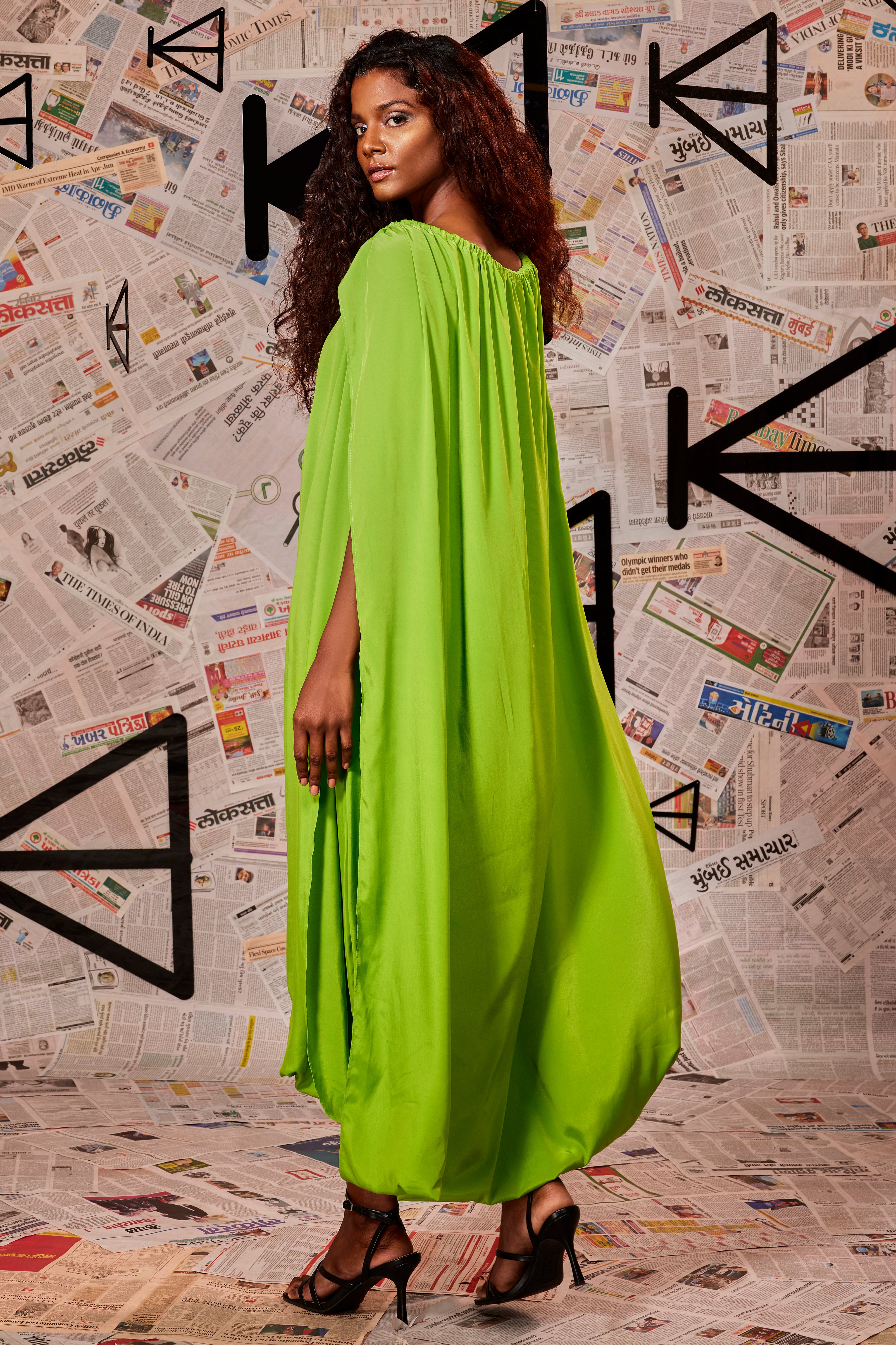 Green FC halter neck mid-length toga dress.