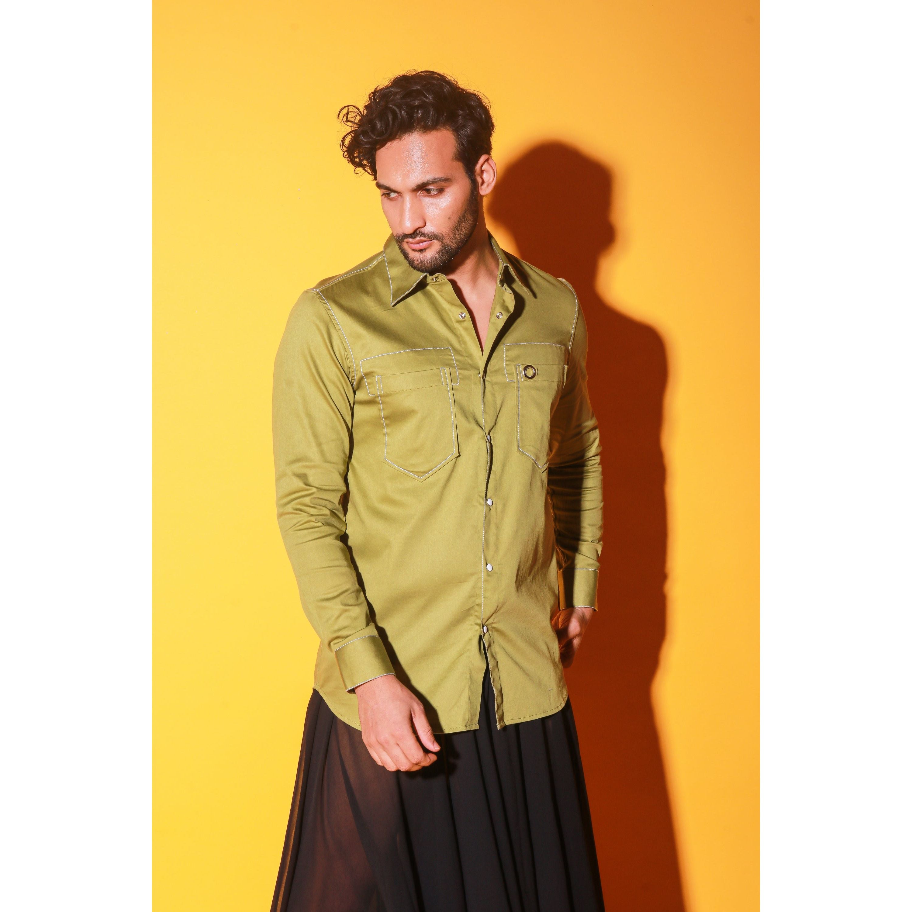 Green shirt with white stitching feature