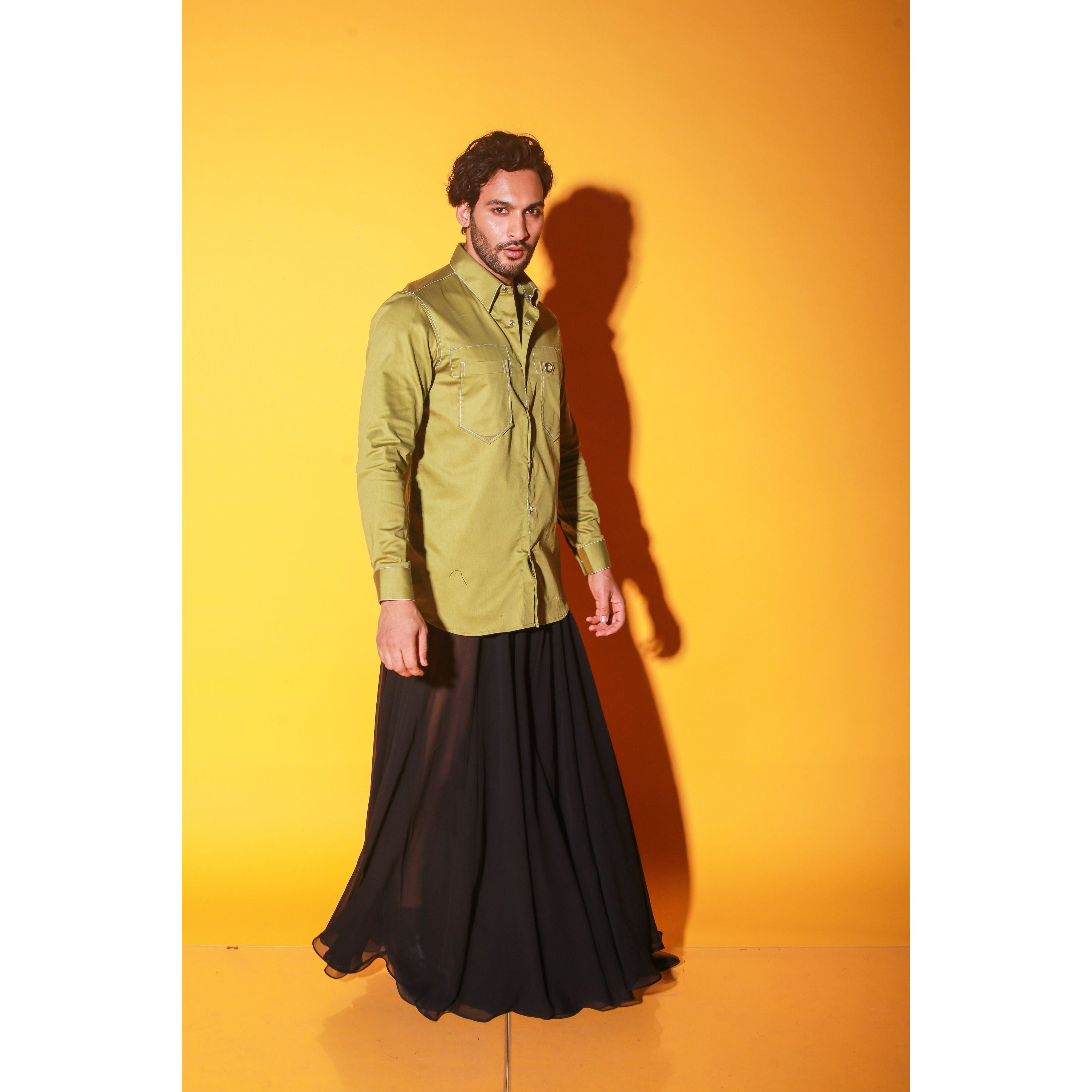 Green shirt with white stitching feature