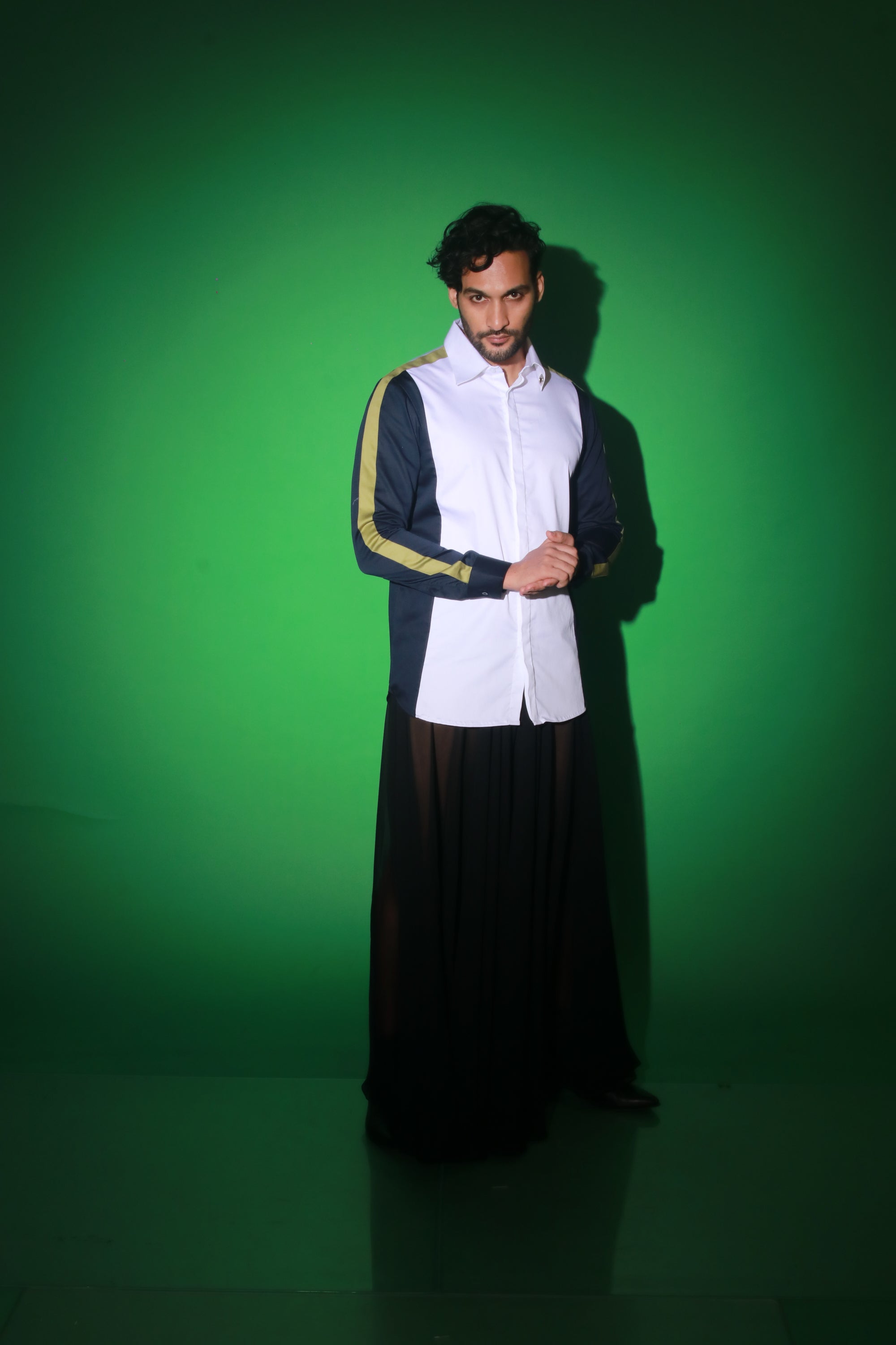 White shirt with blue and moss green strip feature.