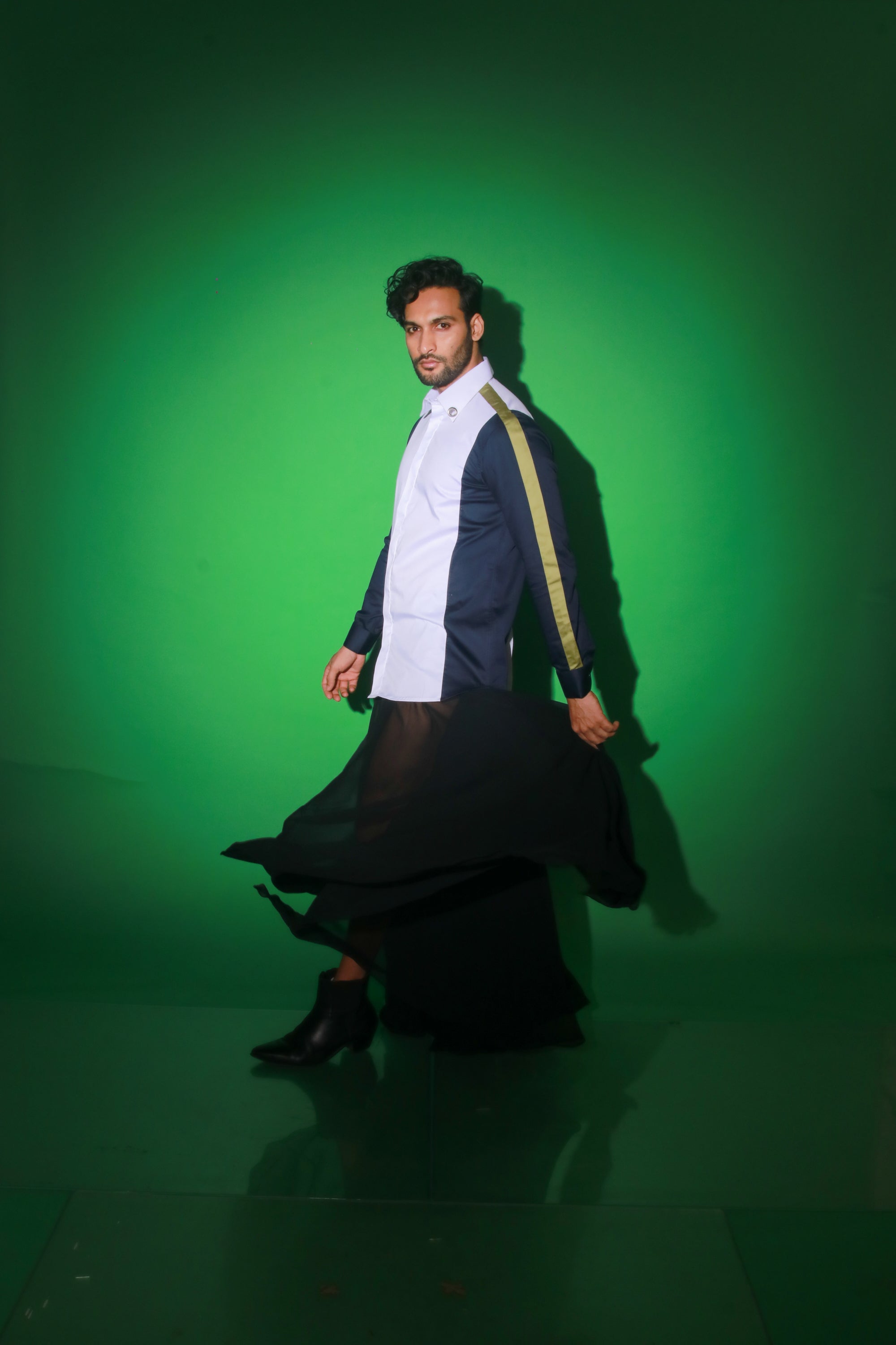 White shirt with blue and moss green strip feature.