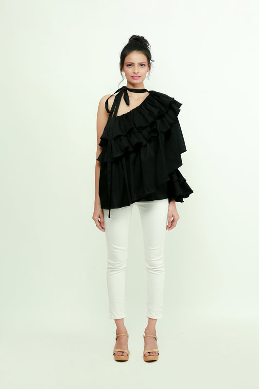 Black one shoulder top features a tie-up collar with ruffles and ruched cuff.