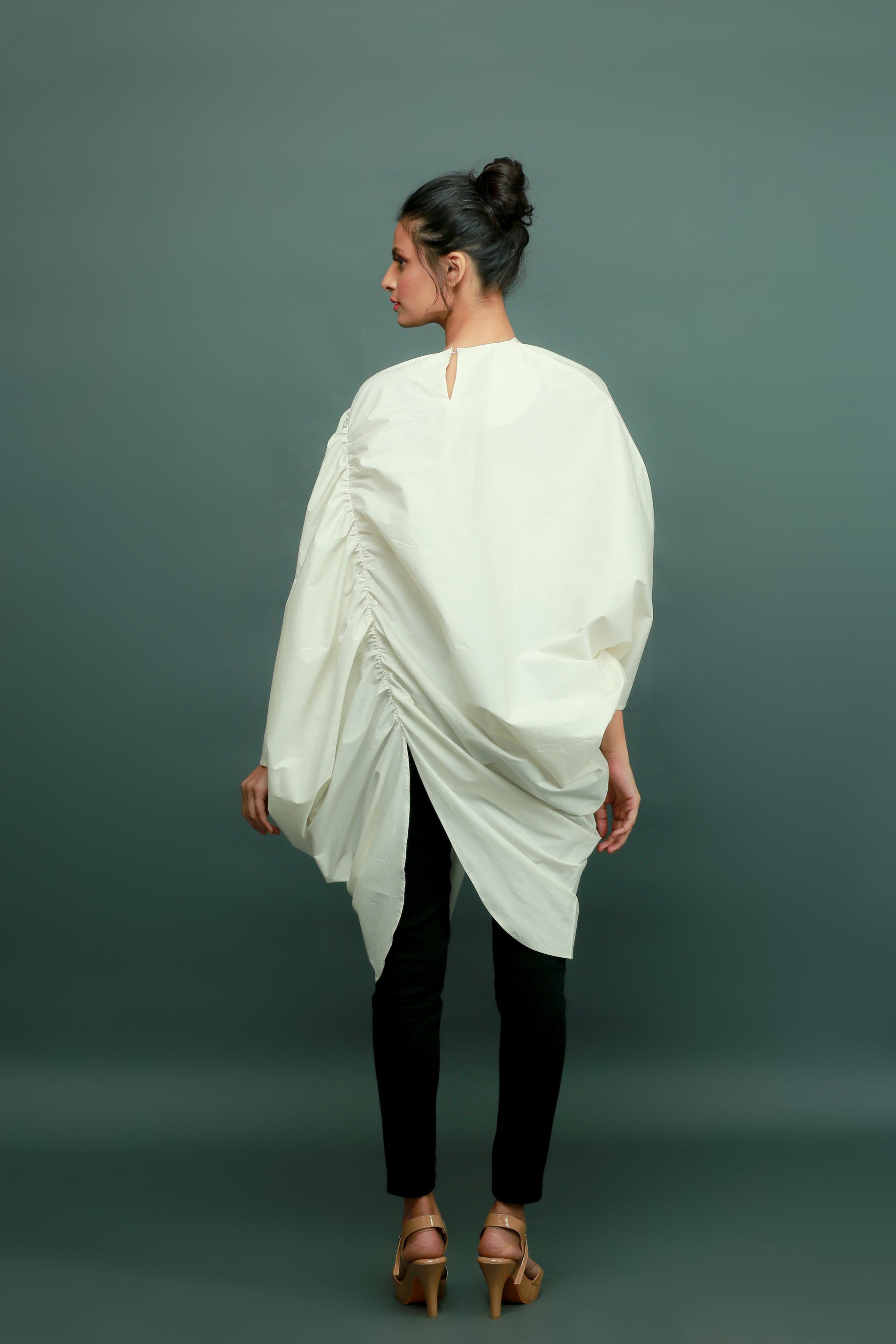 Off-white raglan sleeves top with gathers and a self-button feature on the left side.