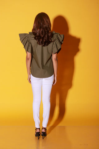 Olive green shirt features ruffles and black pipeing on the yoke.