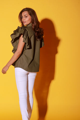 Olive green shirt features ruffles and black pipeing on the yoke.