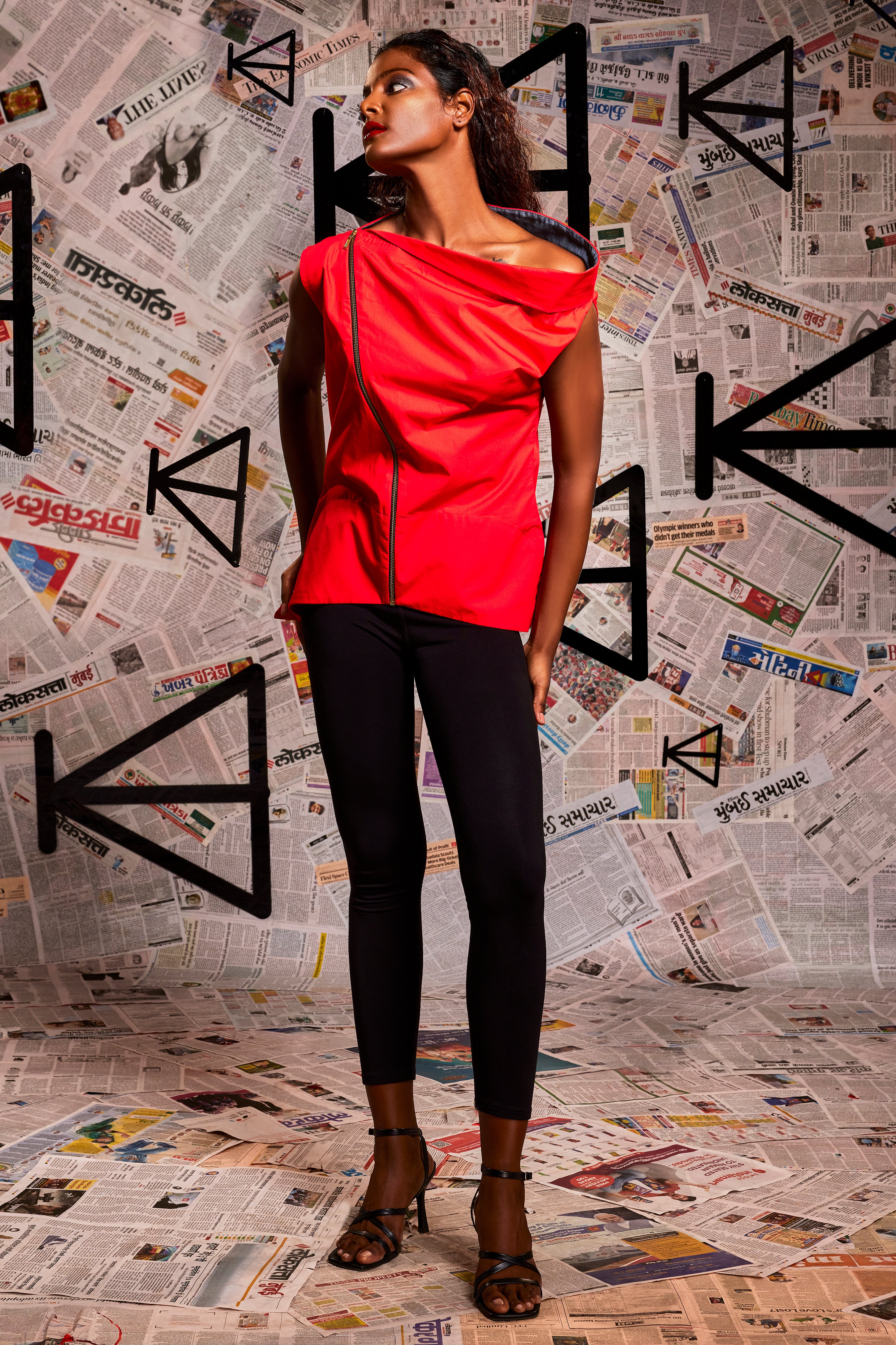 Tomato red asymmetric shoulder top with slant zipper detailing and denim facing accents.