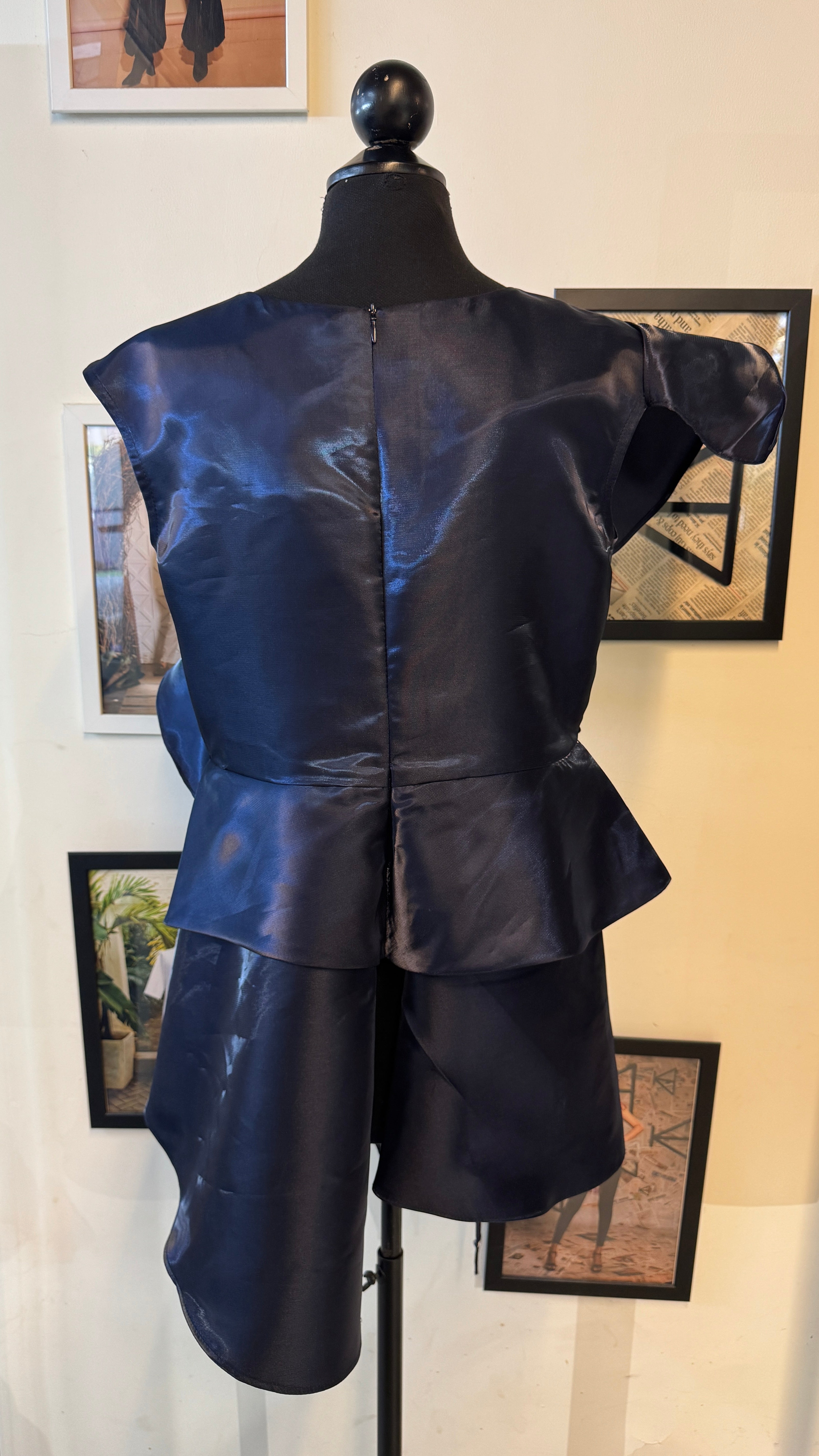 Blue Metallic Peplum Top With Ruffles And Layers On It