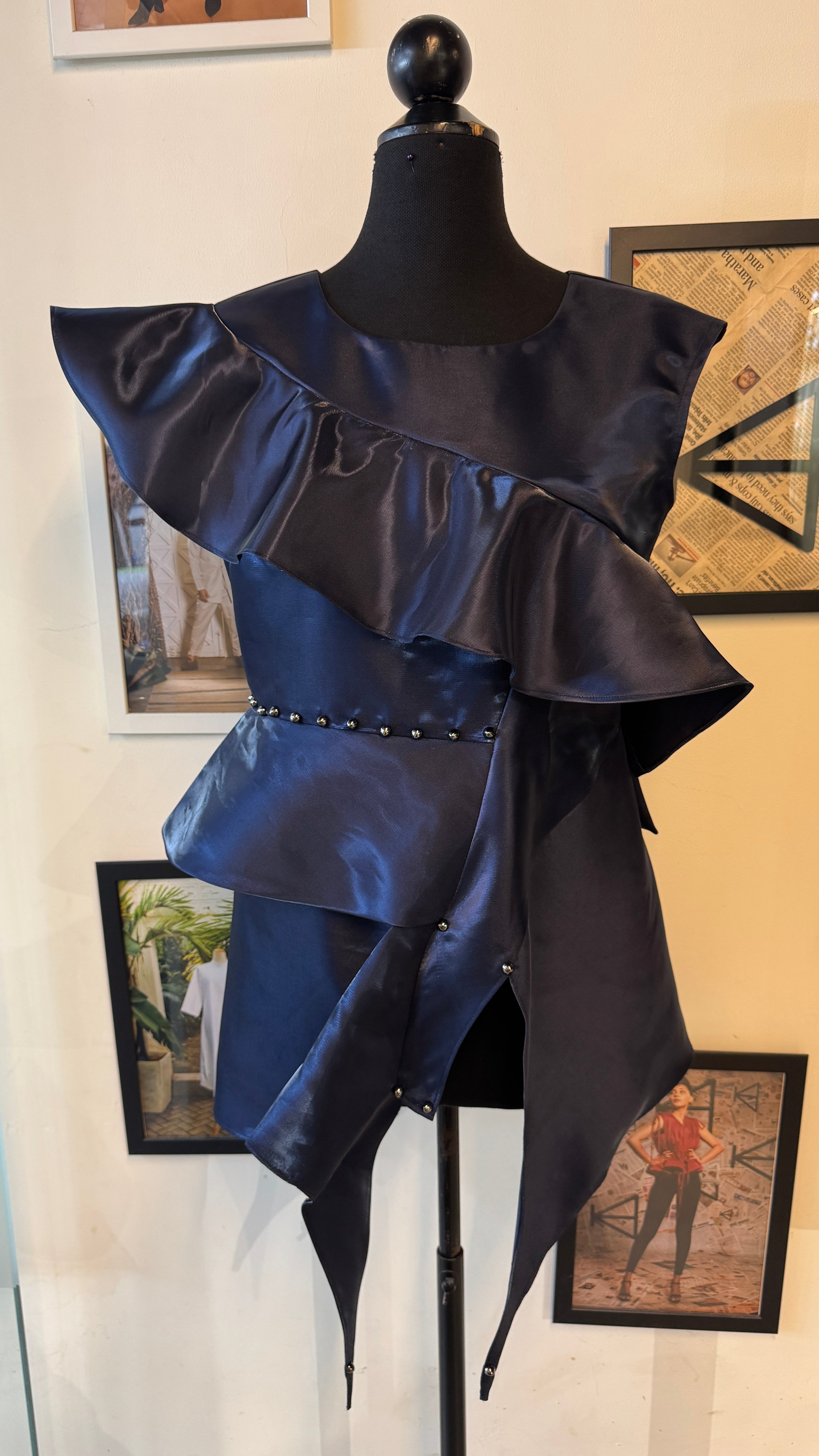 Blue Metallic Peplum Top With Ruffles And Layers On It