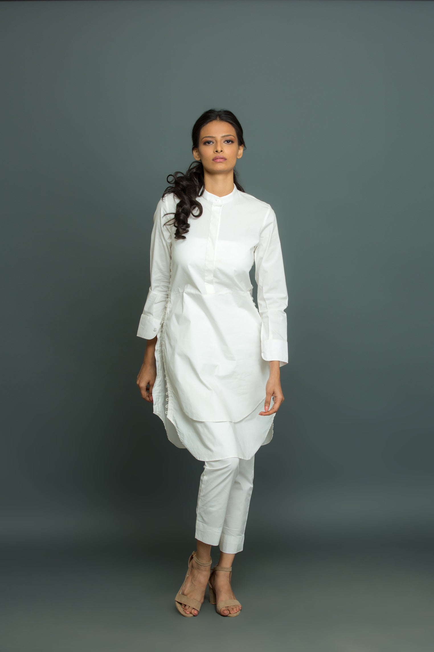 White co-ord set features a kurta-inspired top with chinese collar and narrow pants.