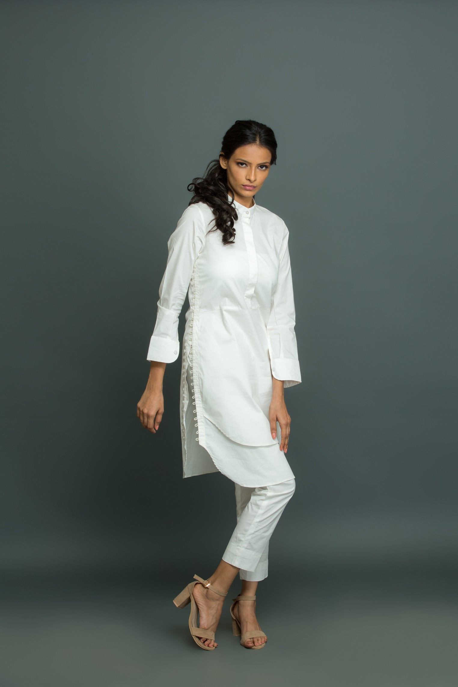White co-ord set features a kurta-inspired top with chinese collar and narrow pants.