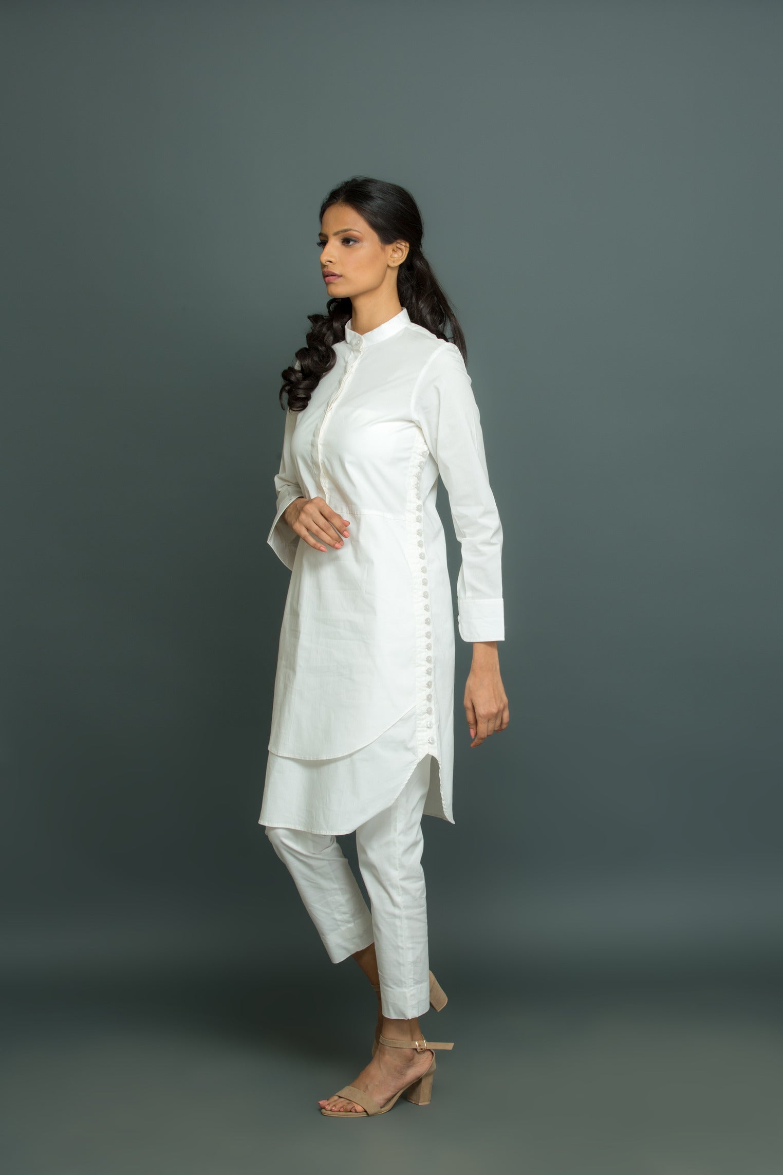 White co-ord set features a kurta-inspired top with chinese collar and narrow pants.
