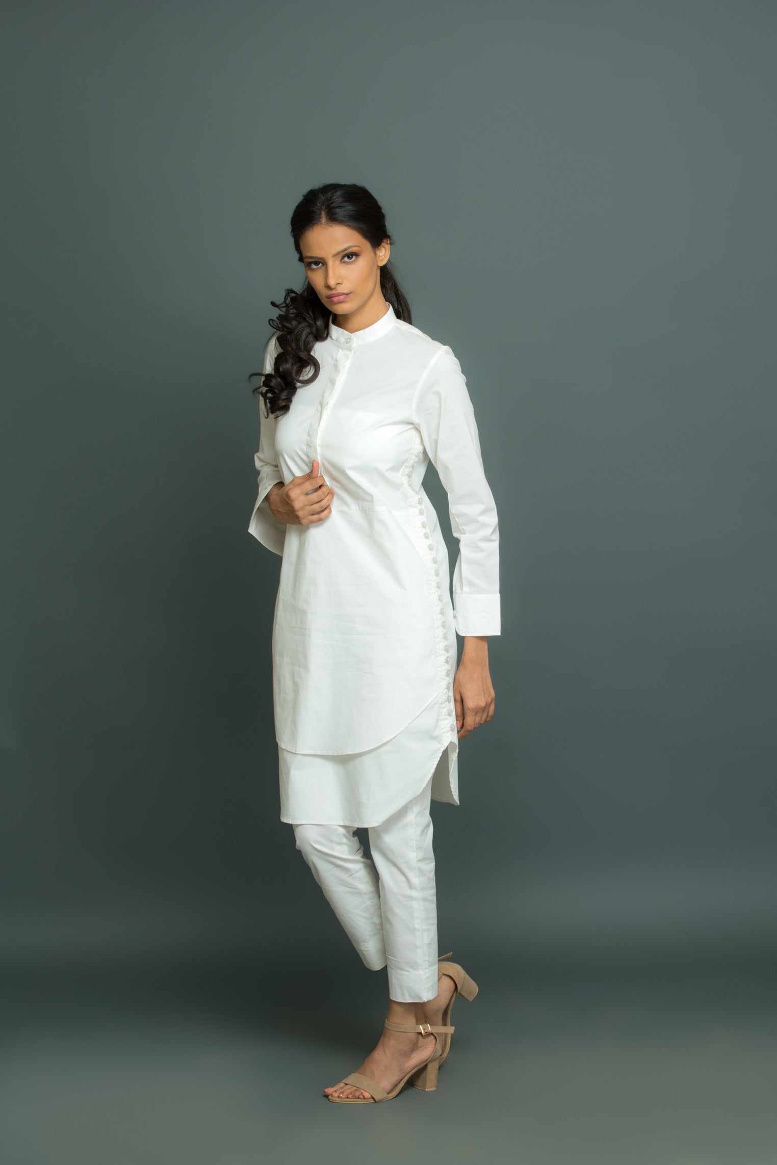 White co-ord set features a kurta-inspired top with chinese collar and narrow pants.