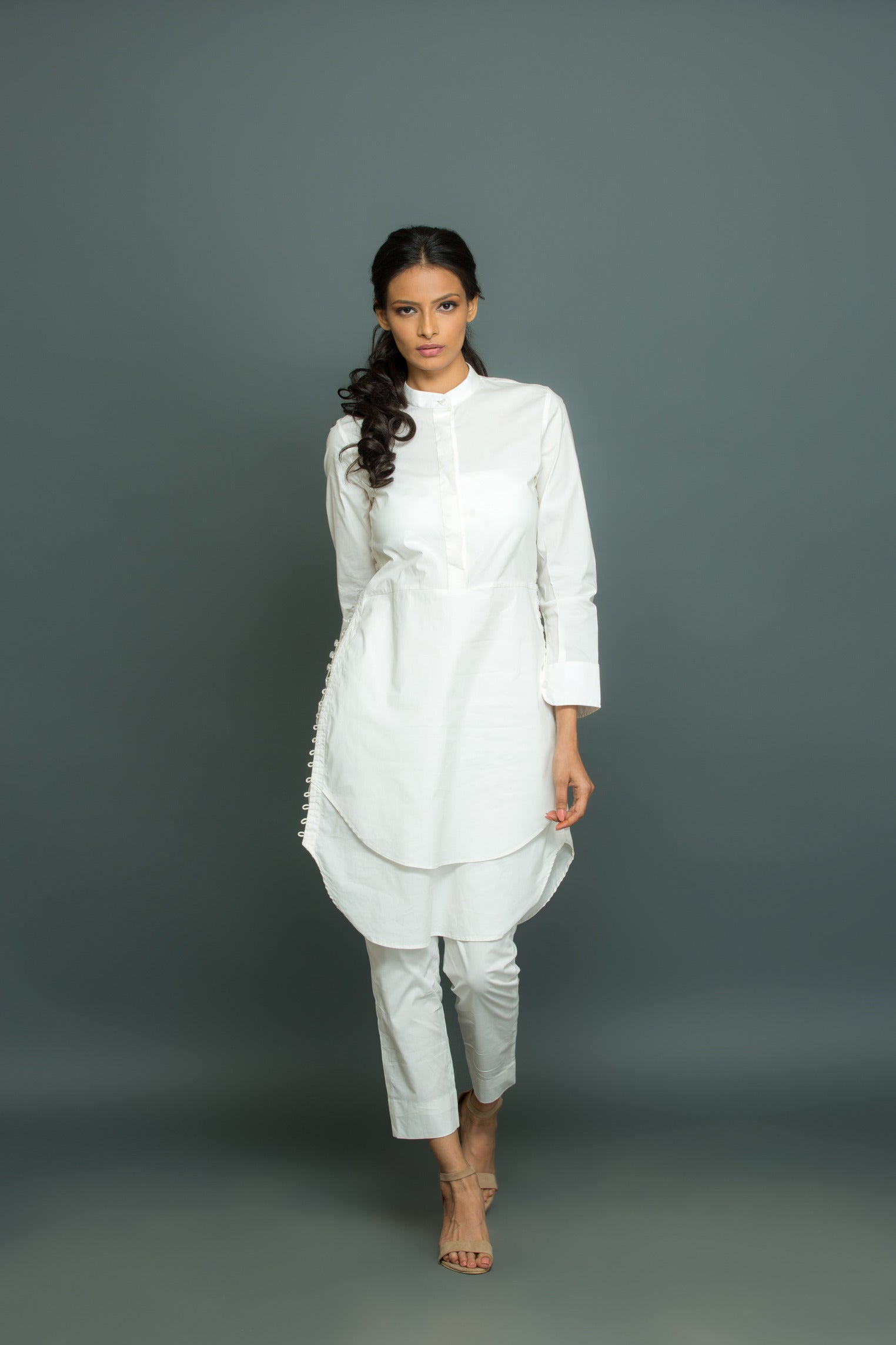 White co-ord set features a kurta-inspired top with chinese collar and narrow pants.