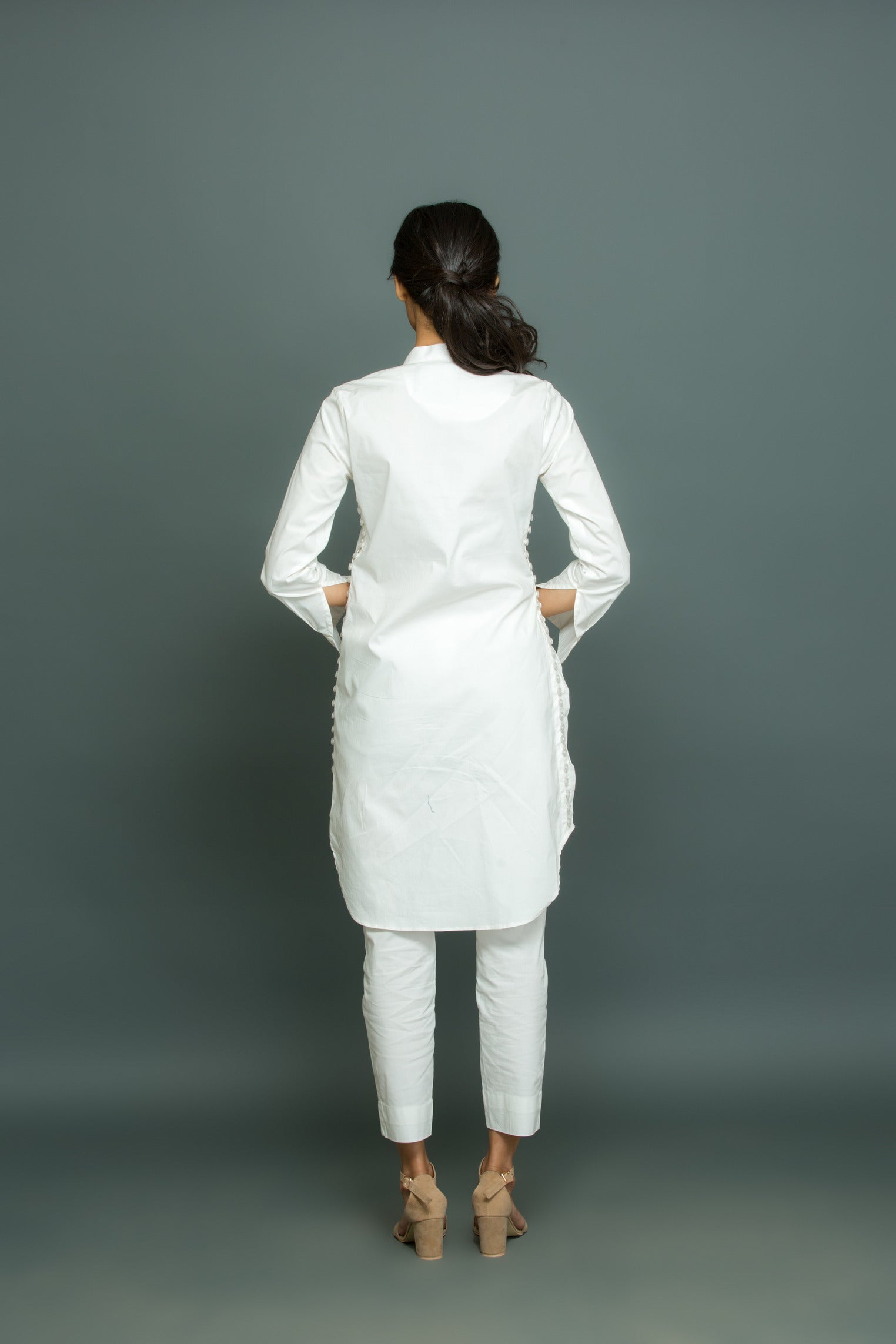 White co-ord set features a kurta-inspired top with chinese collar and narrow pants.