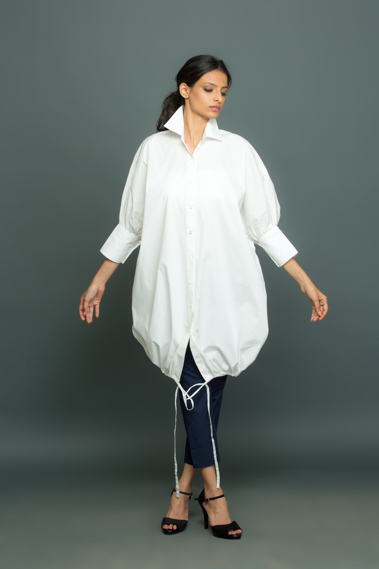 Blue and white co-ord set features an oversized white shirt with tie-up detailing and slim fit pants.