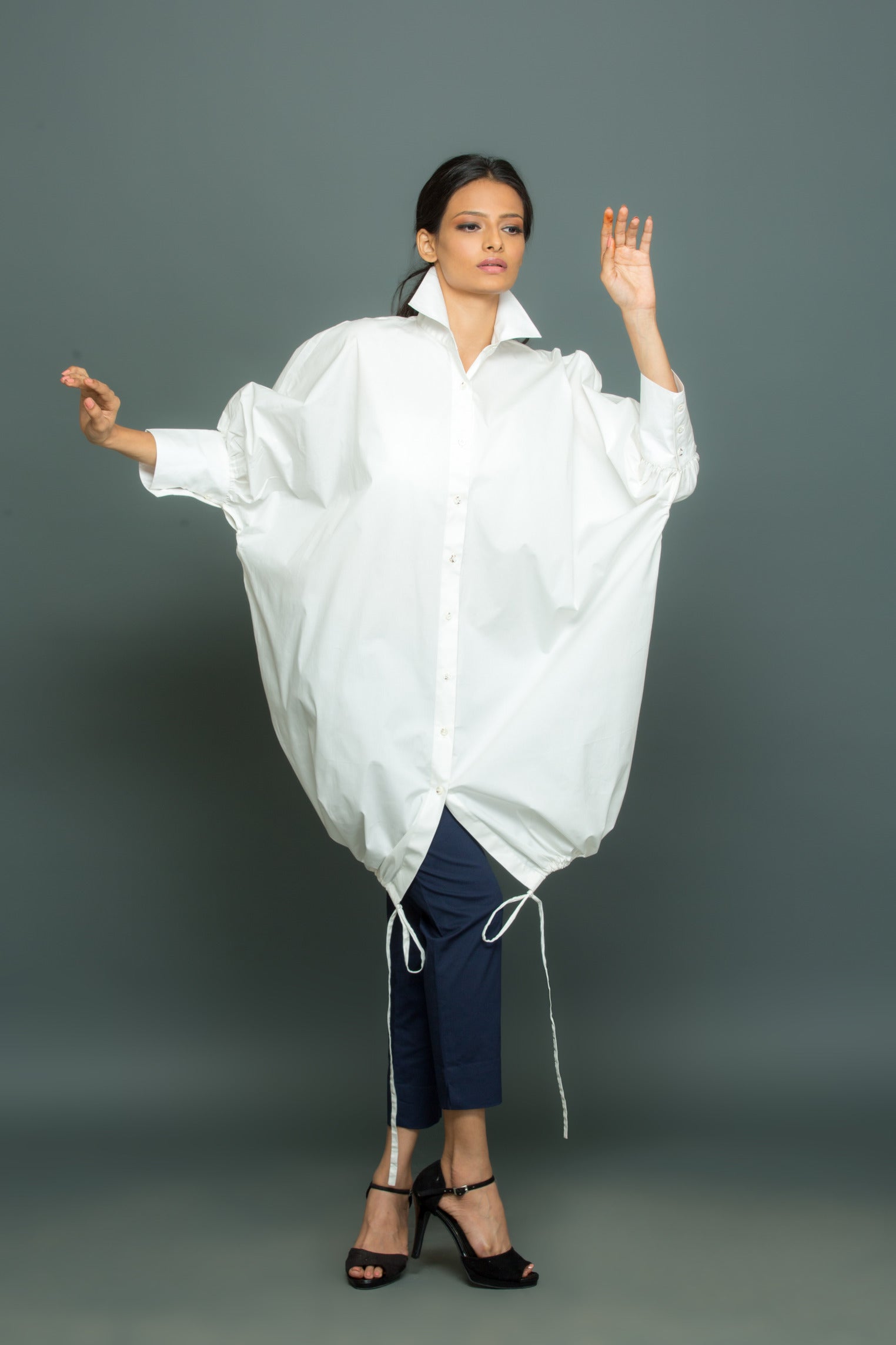 Blue and white co-ord set features an oversized white shirt with tie-up detailing and slim fit pants.