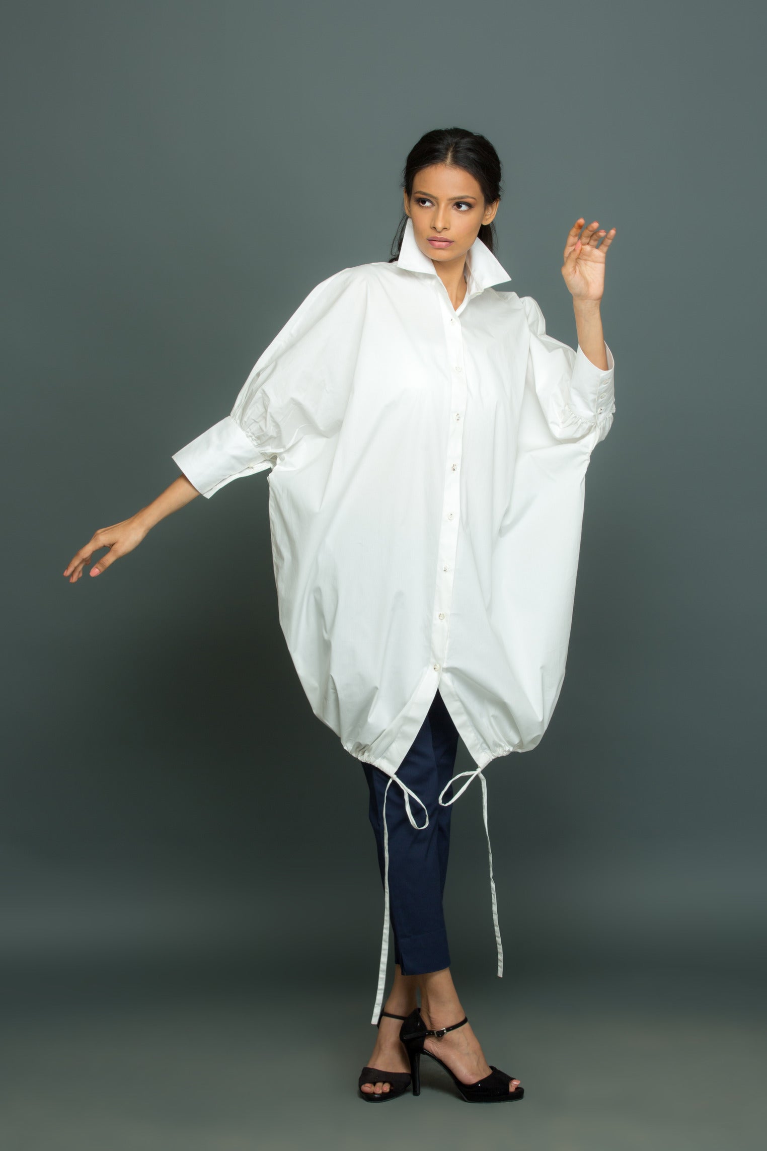 Blue and white co-ord set features an oversized white shirt with tie-up detailing and slim fit pants.