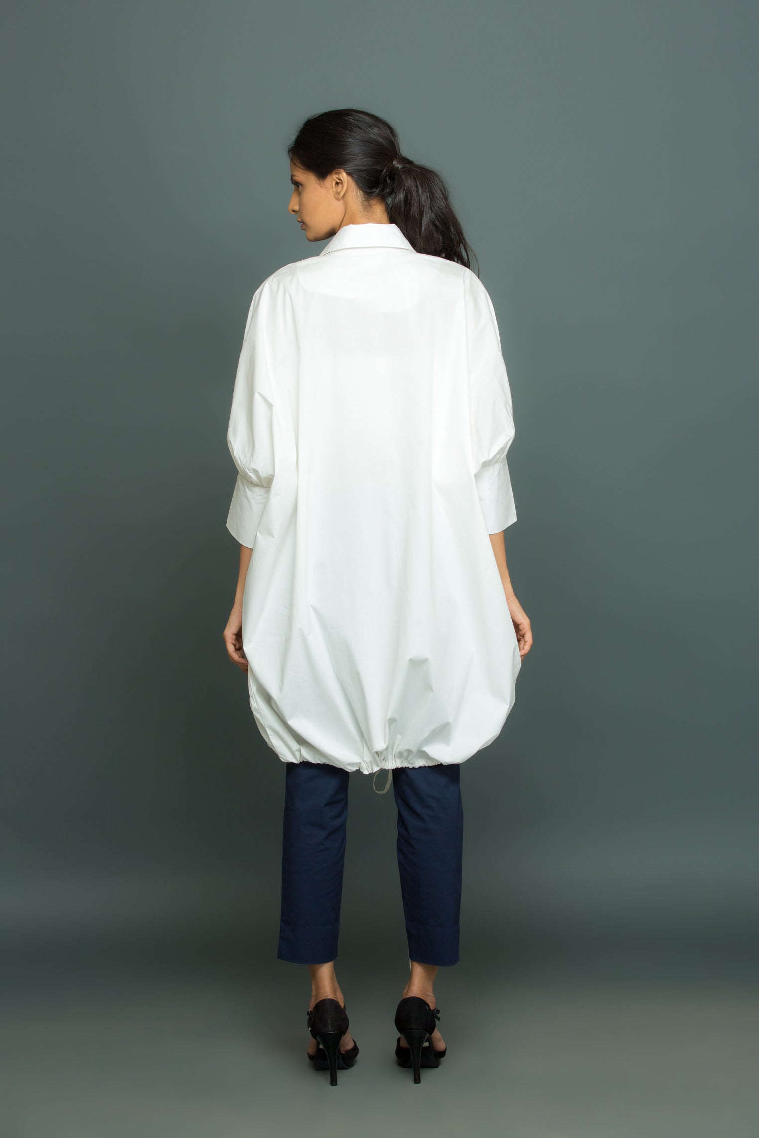 Blue and white co-ord set features an oversized white shirt with tie-up detailing and slim fit pants.