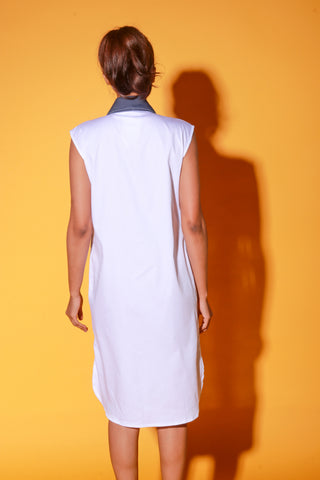 White and denim sleeveless shirt dress features supersized pockets.