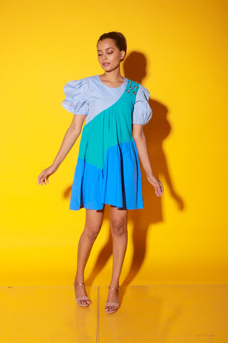 Turquoise, slate and powder blue short dress features balloon sleeves and eyelet feature on one shoulder.