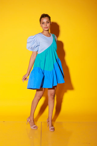 Turquoise, slate and powder blue short dress features balloon sleeves and eyelet feature on one shoulder.