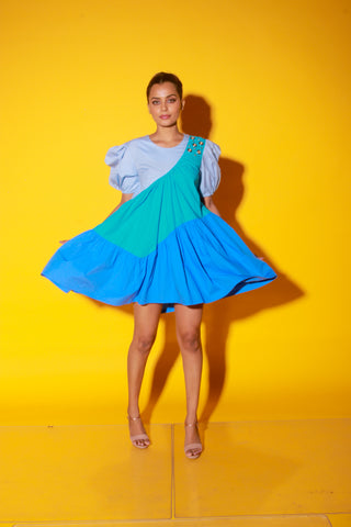 Turquoise, slate and powder blue short dress features balloon sleeves and eyelet feature on one shoulder.