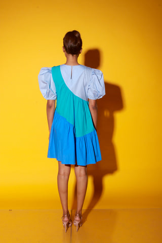 Turquoise, slate and powder blue short dress features balloon sleeves and eyelet feature on one shoulder.