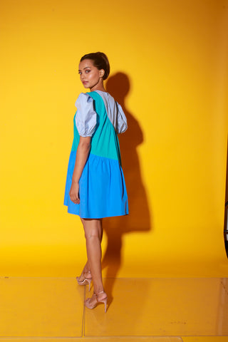 Turquoise, slate and powder blue short dress features balloon sleeves and eyelet feature on one shoulder.