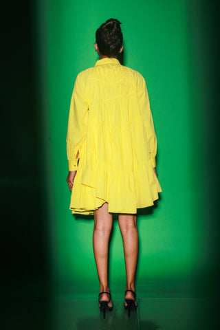 Yellow short tiered dress features a distinct collar and 3/4th sleeves.