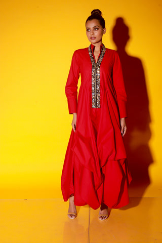 Red maxi length dress features a chinese collar with long sleeves and asymmetric balloon feature.