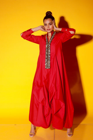 Red maxi length dress features a chinese collar with long sleeves and asymmetric balloon feature.