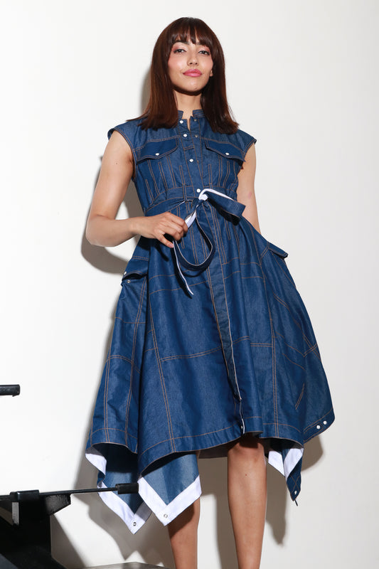 Sleeveless denim maxi dress with a waist belt and asymmetric flare on the sides.