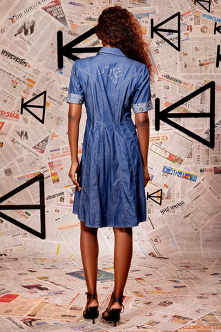 Cotton denim short dress with center zip and stitch detailing with eyelet featured on the sleeves