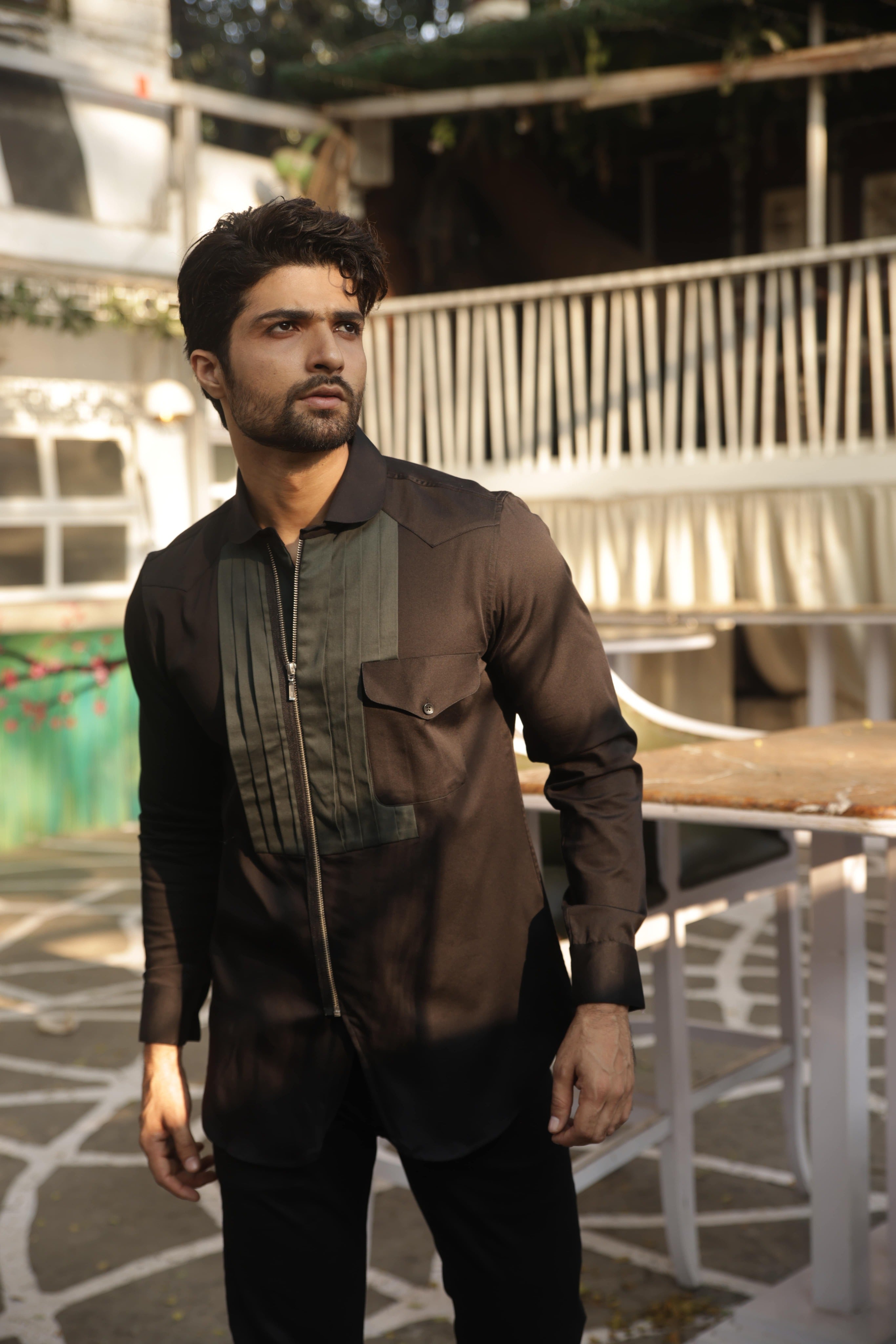 Black shirt with green pleates