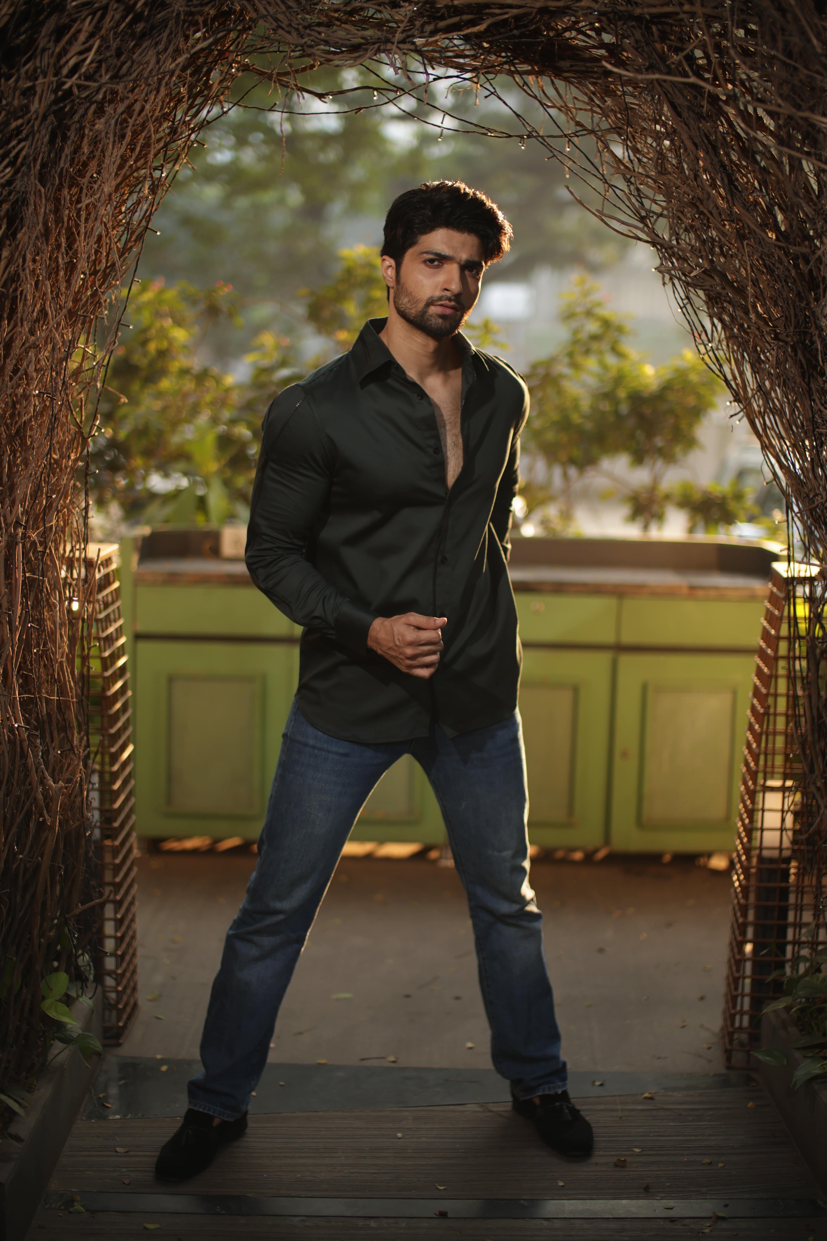 Green shirt with black zipper feature