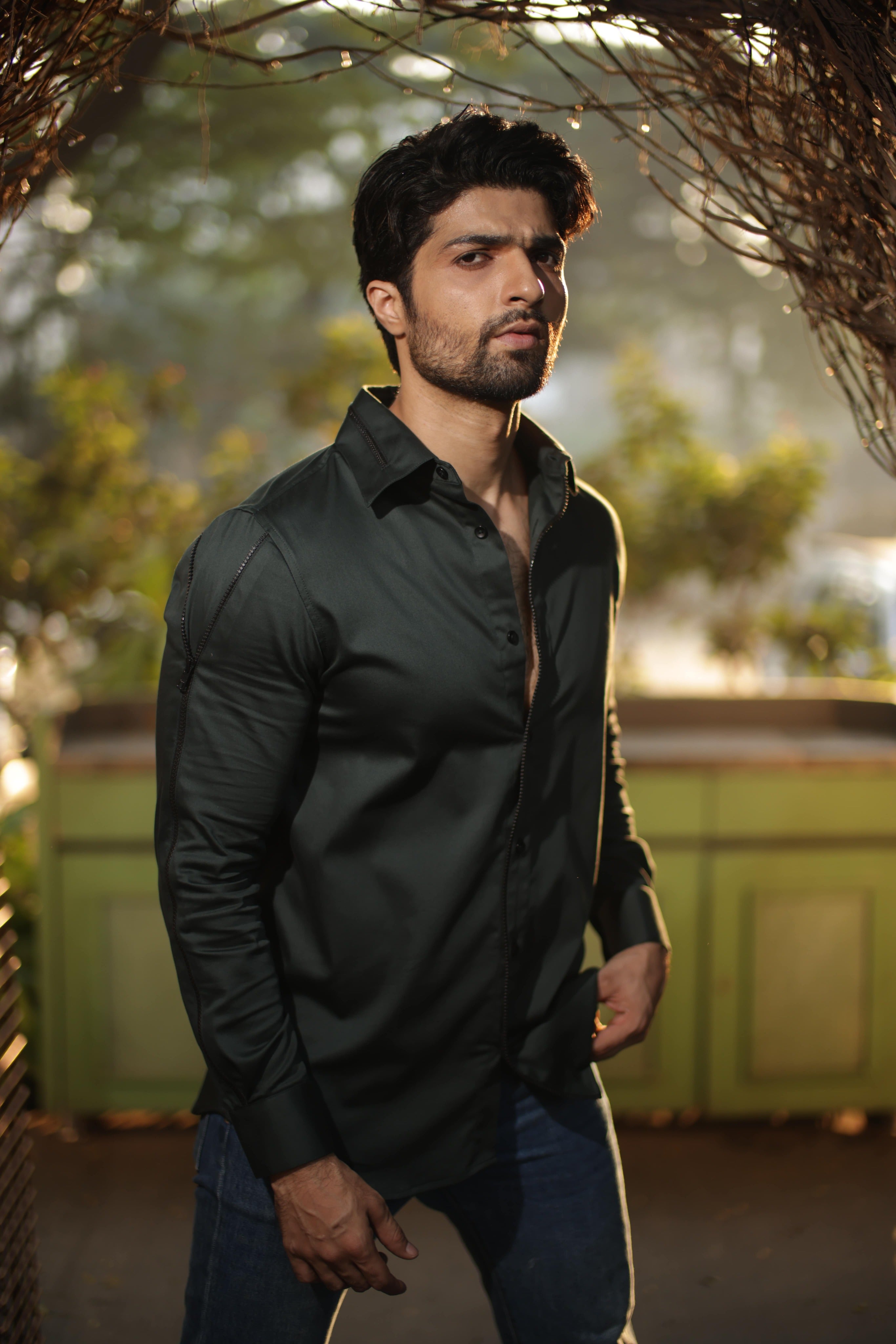 Green shirt with black zipper feature