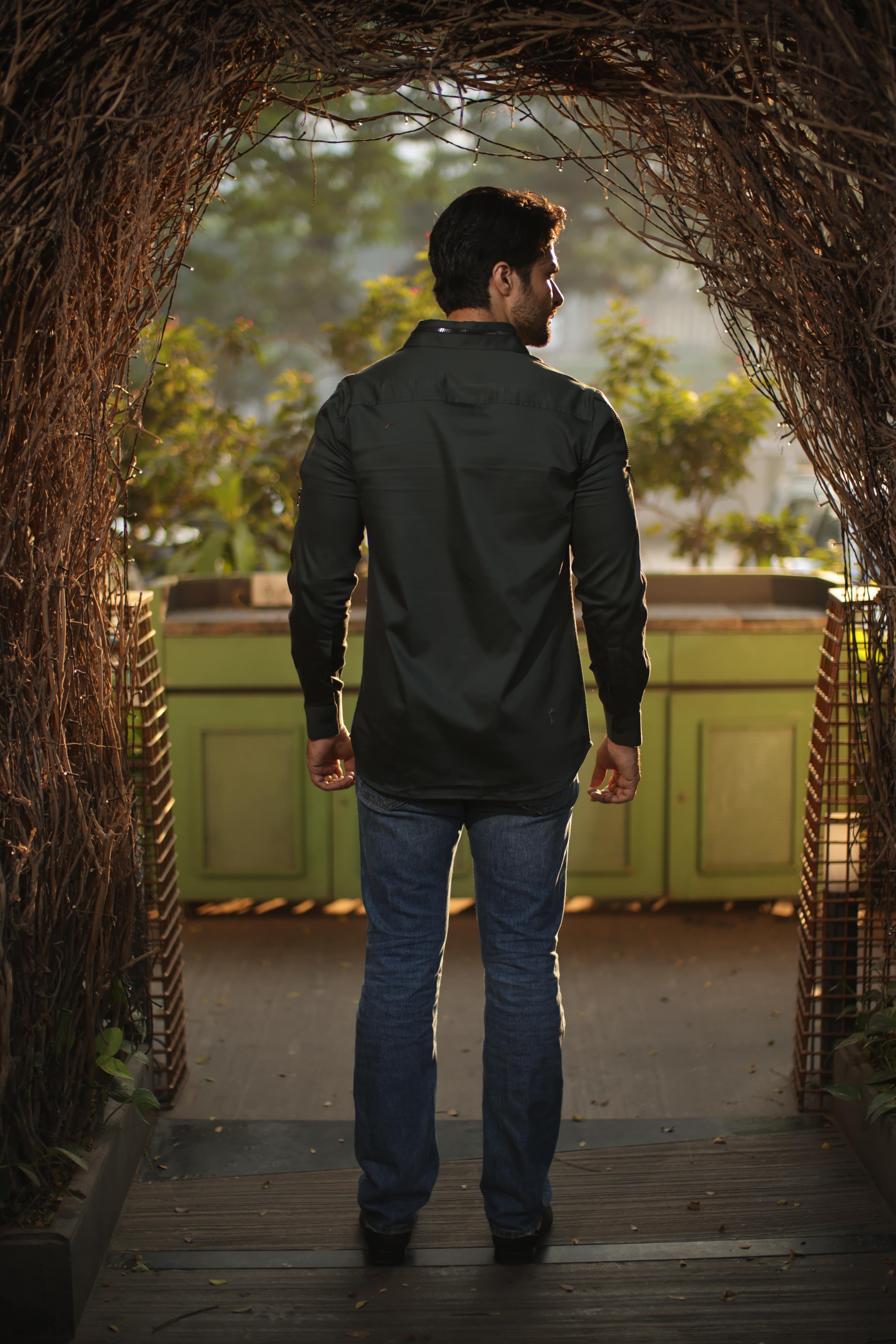 Green shirt with black zipper feature