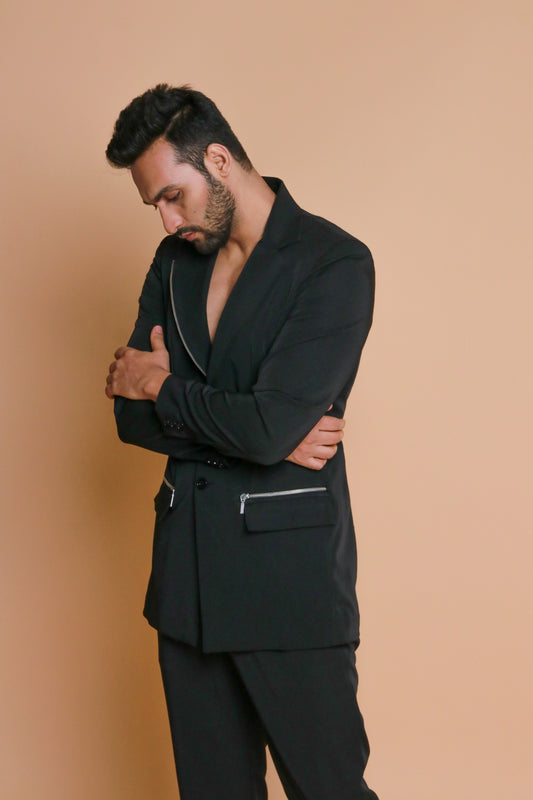 Black jacket with zip detailing and narrow pants.