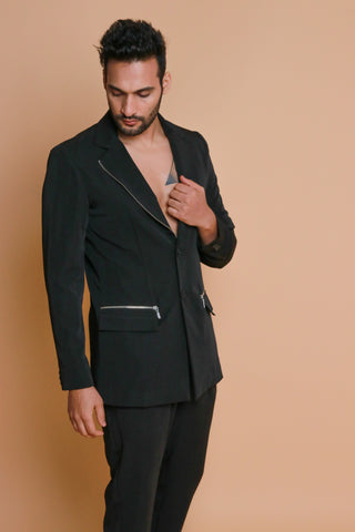 Black jacket with zip detailing and narrow pants.