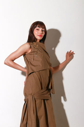 Brown long tie-up dress with eyelets and chains on one side.