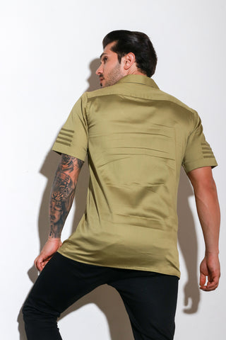 Green half sleeve shirt with self piping stripes and zipper feature.