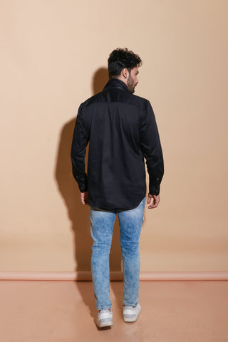 Black full sleeve shirt with self zipper pocket and placket feature.