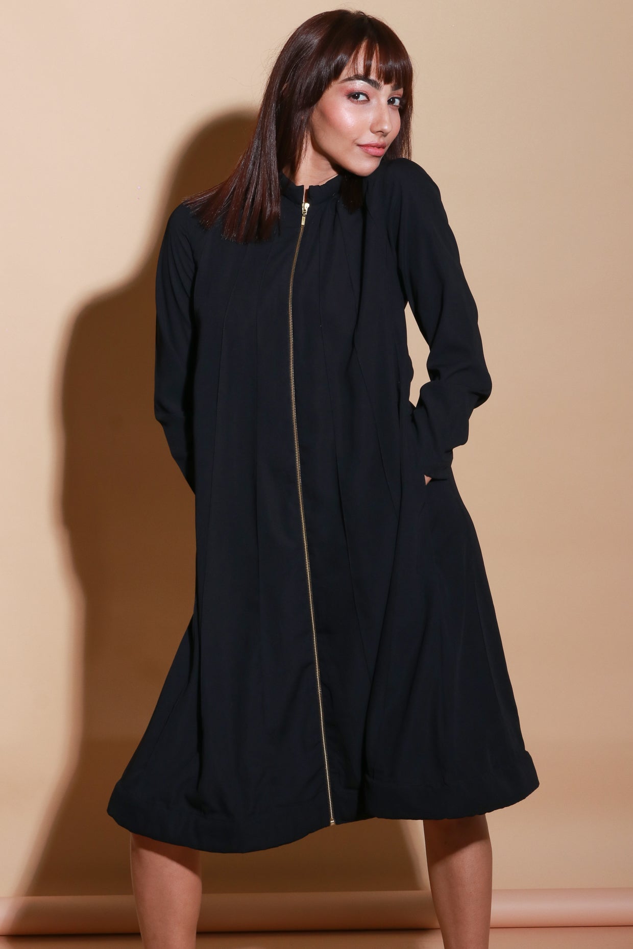 Quilted neck and hem flared dress with zipper feature.