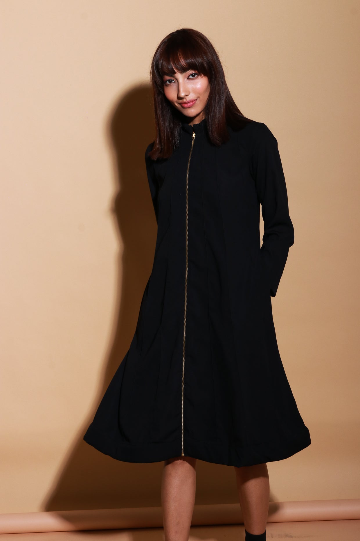 Quilted neck and hem flared dress with zipper feature.