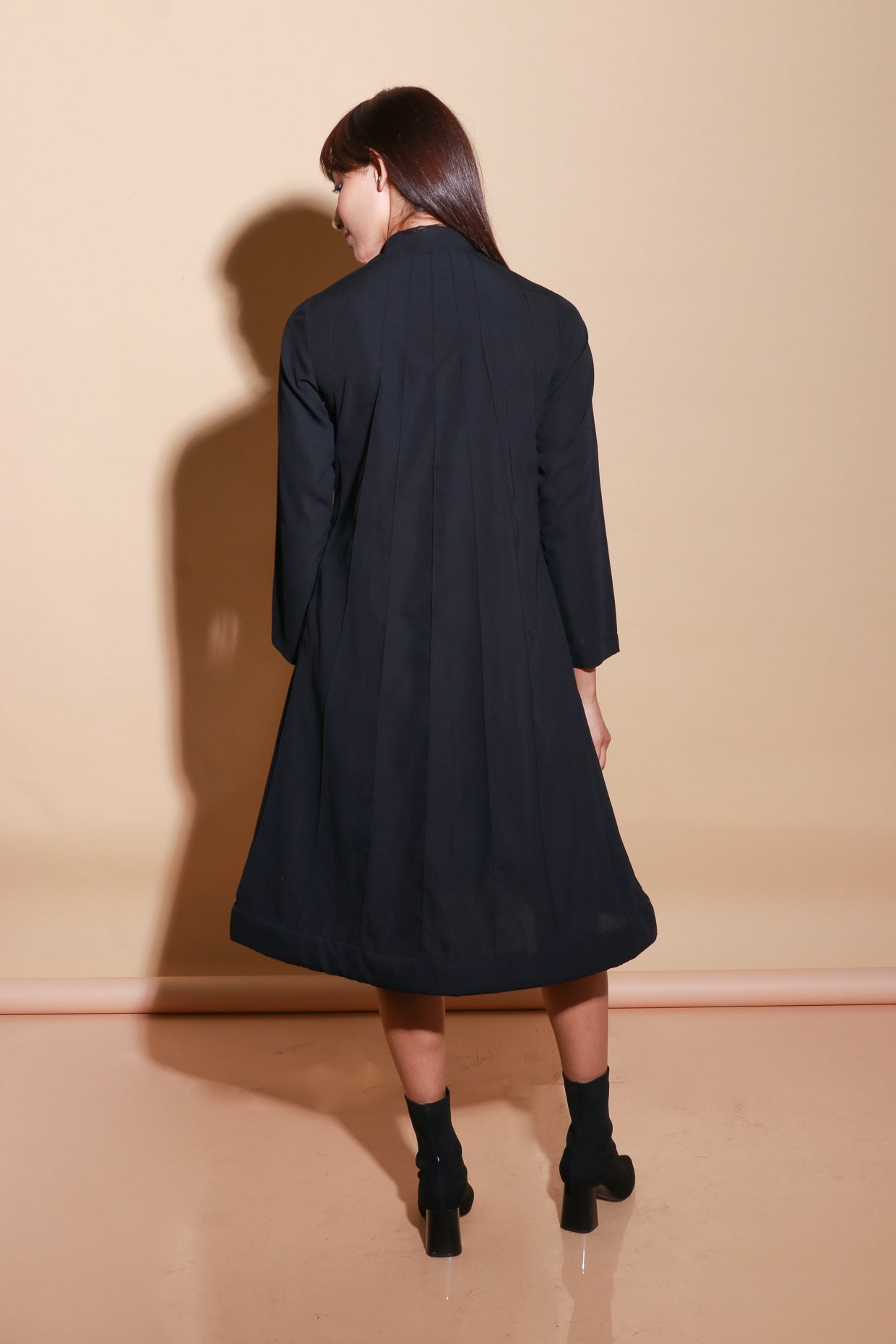 Quilted neck and hem flared dress with zipper feature.