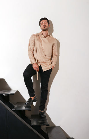 Beige classic shirt with diagonal flap with buckle.