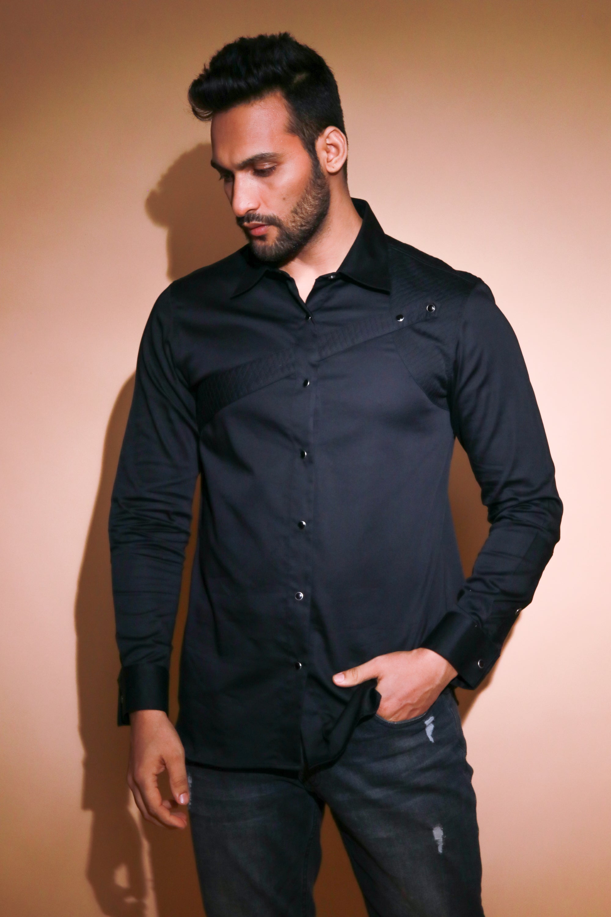 Black shirt with quilted and piping feature.