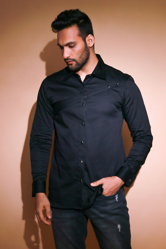 Black shirt with quilted and piping feature.