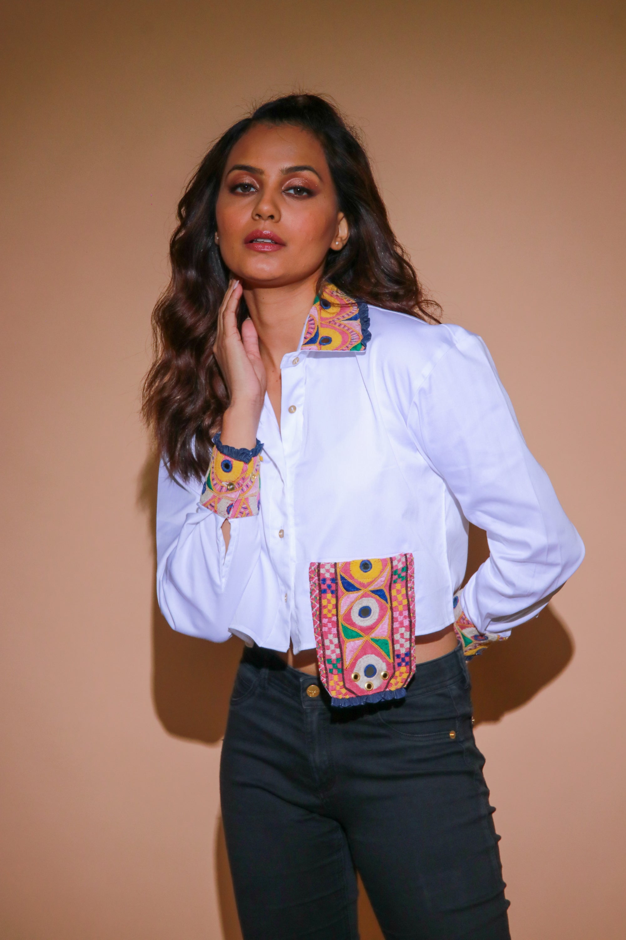 White crop top with Kutch border accents on the cuffs and and extended patch pocket.