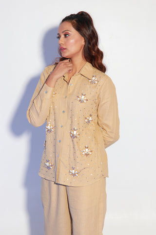 Beige co-ord set in pure linen with stone embellishment on shirt.